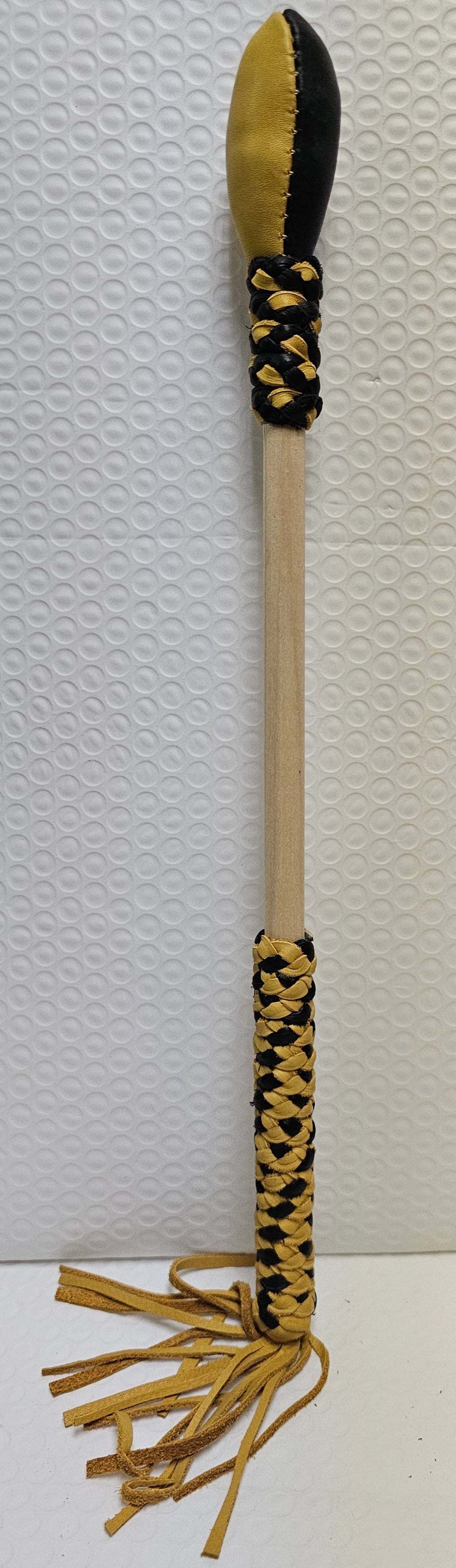 Black and tan drum stick