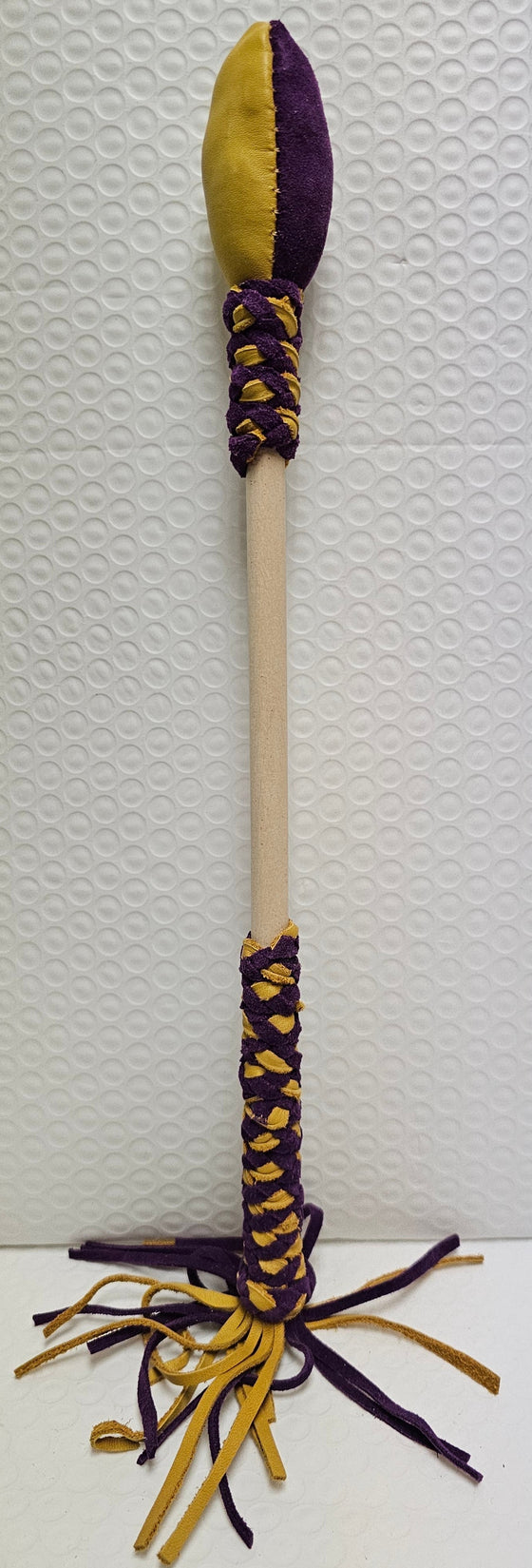 Tan and purple drum stick